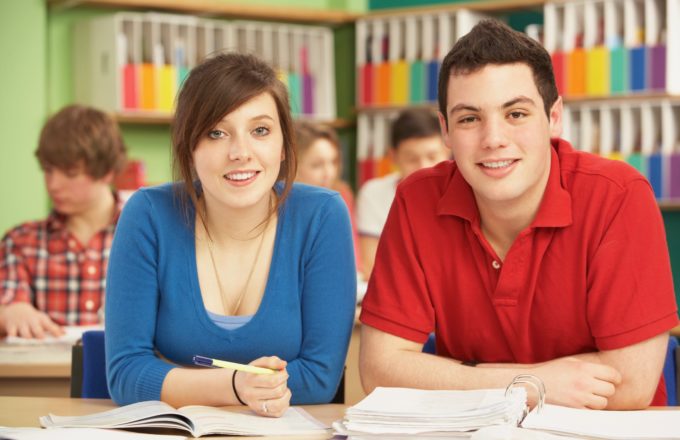 Teenage Students Studying In Classroom