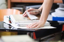 A student taking purposeful research notes