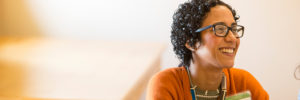 smiling woman in a brightly lit room
