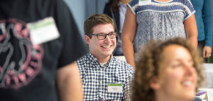 smiling man and woman in a large room