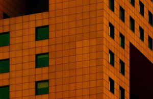 A building with visible parts representing how each piece makes a whole building