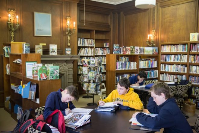 Students reading in a group in a library