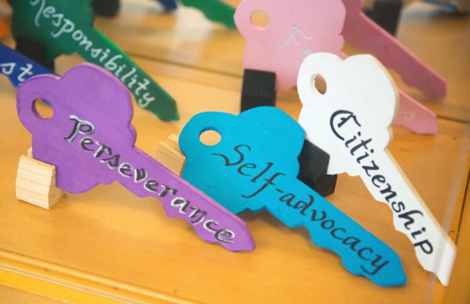 A picture of different colored key with words written on them