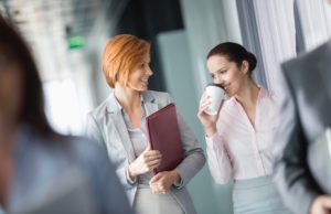 Businesswomen walking in office corridor