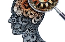 Brain decline and dementia or aging as memory loss concept for brain cancer decay or an Alzheimer's disease with the medical icon of a old rusting mechanical gears and cog wheels of metal in the shape of a human head with rust.