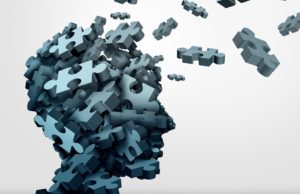 Dementia puzzle concept brain health problem symbol as a neurology and psychology icon as a a group of 3D illustration jigsaw pieces shaped as a human head as a mental health or memory loss disorder.
